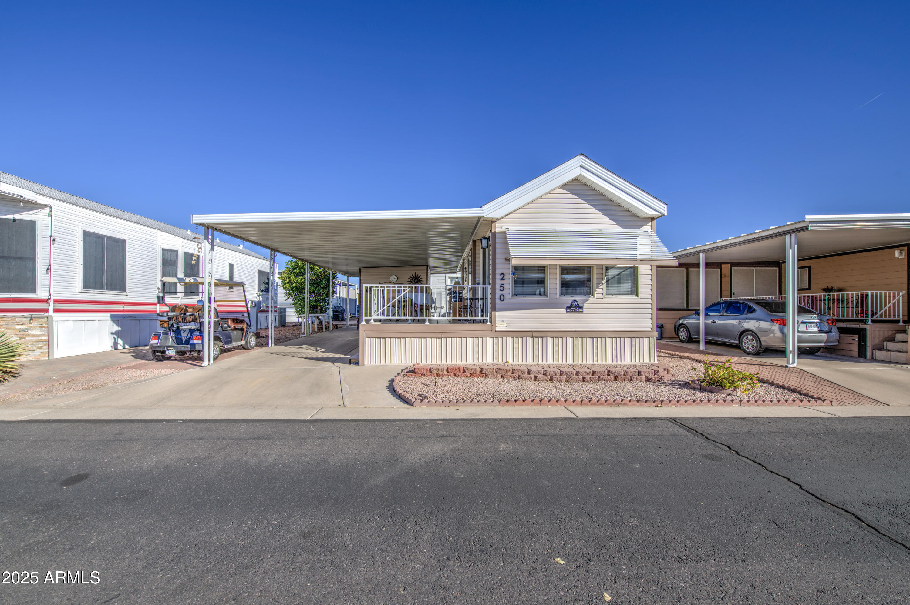7750 East Broadway Road, Unit 250 Mesa, AZ 85208 - Photo 21 of 35 a patio with a table and chairs under an umbrella