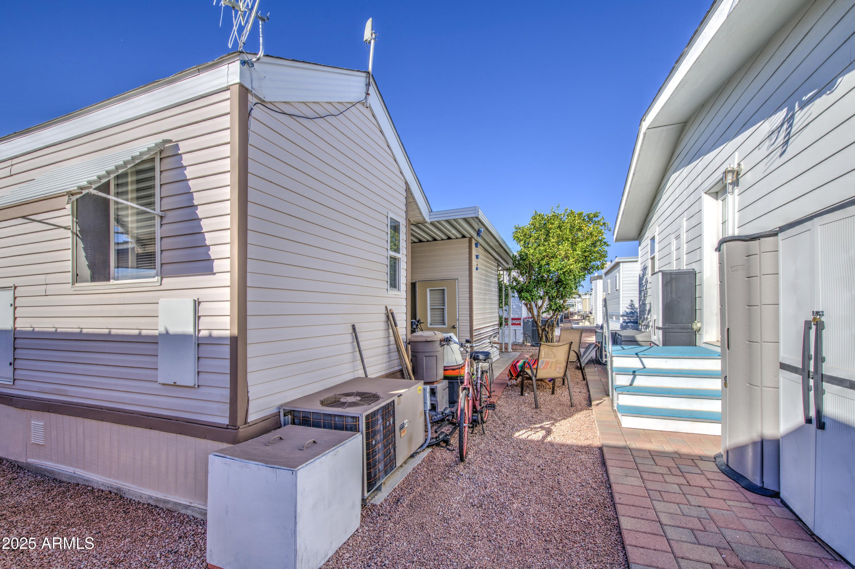 7750 East Broadway Road, Unit 250 Mesa, AZ 85208 - Photo 23 of 35 a view of a patio with table and chairs and potted plants
