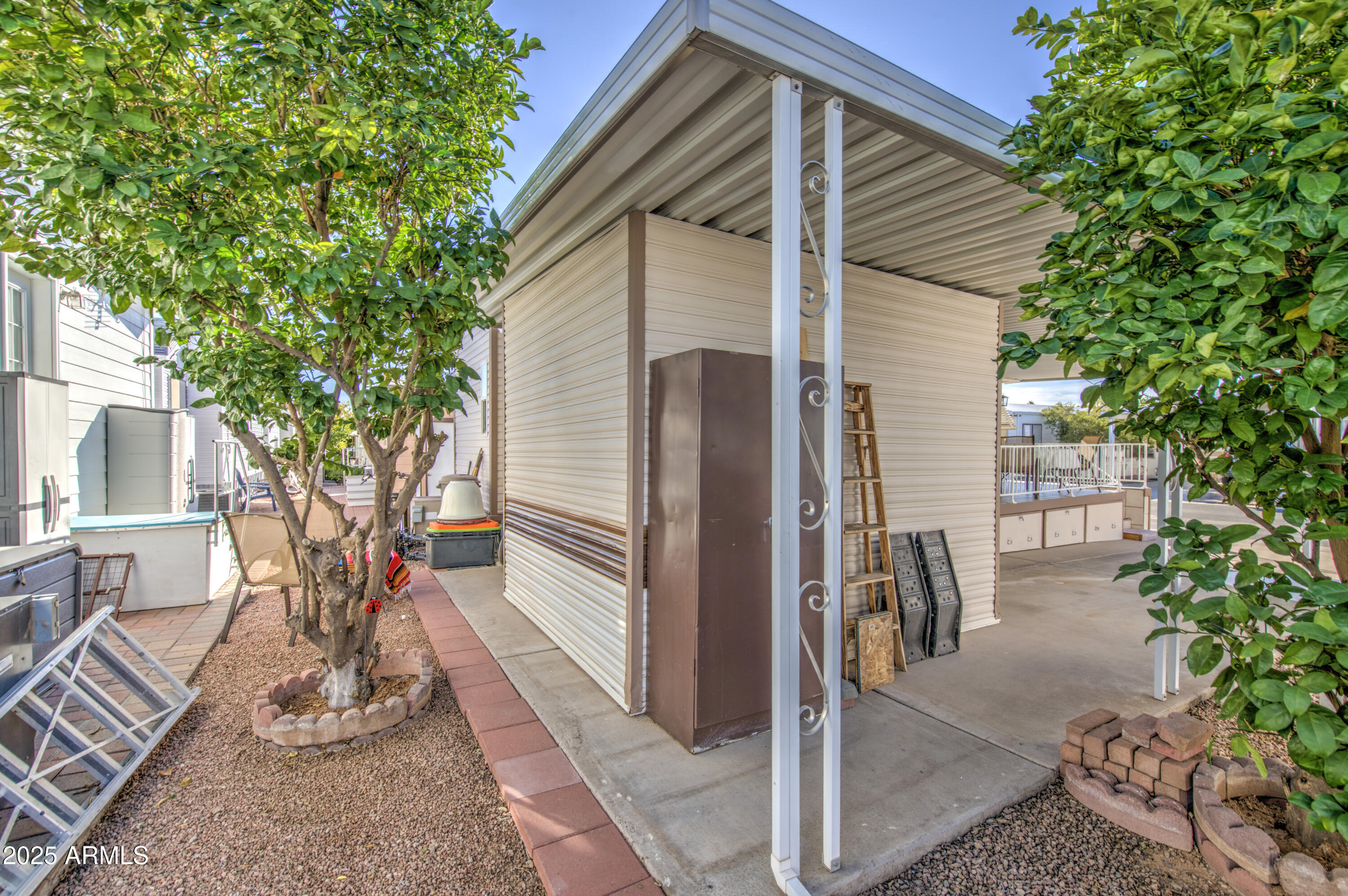 7750 East Broadway Road, Unit 250 Mesa, AZ 85208 - Photo 24 of 35 a front view of a house with garden