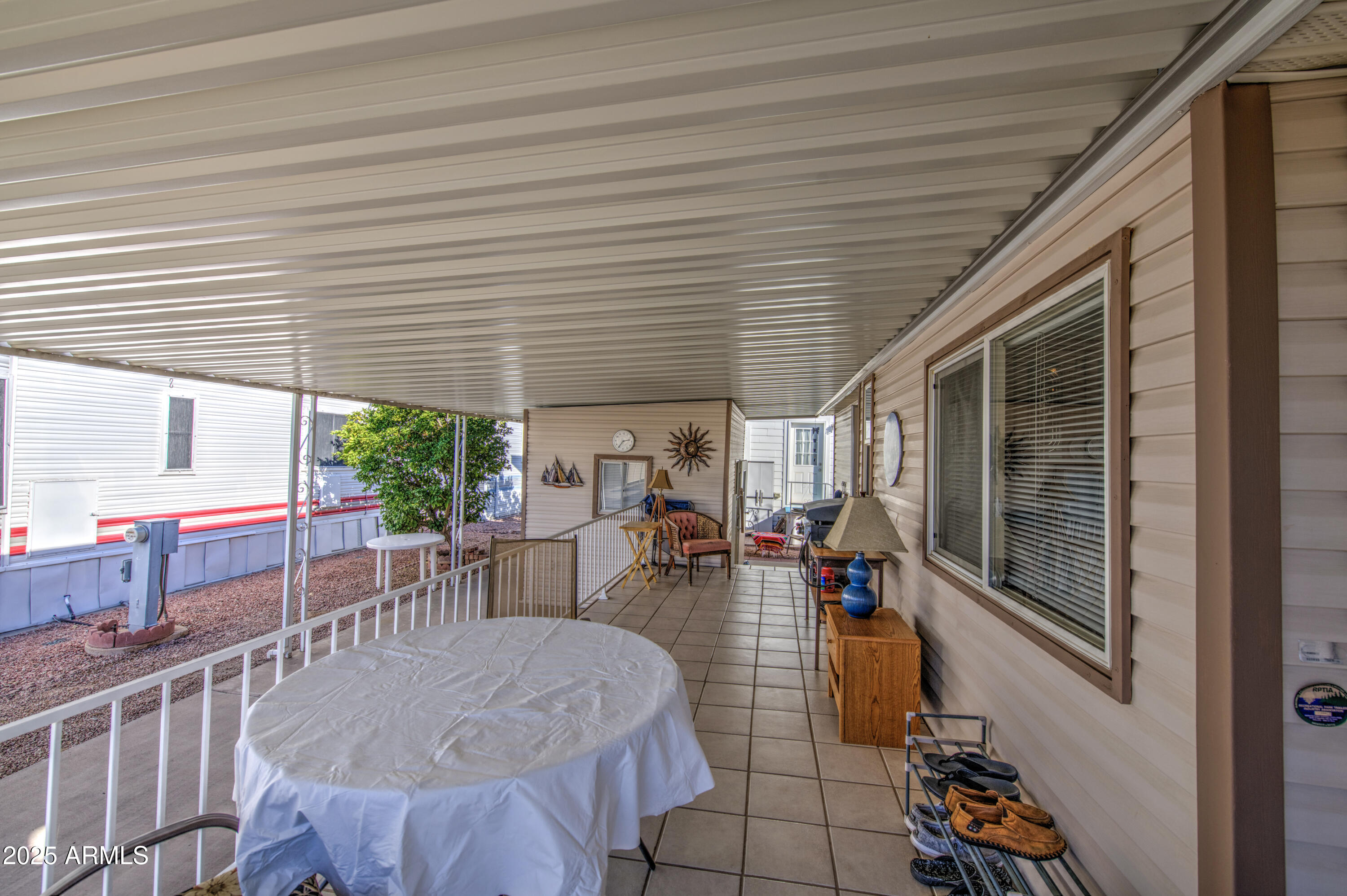 7750 East Broadway Road, Unit 250 Mesa, AZ 85208 - Photo 6 of 35 a outdoor space with lots of tables a garden view and chairs