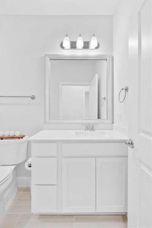651 Watters Road, Unit 4403 Allen, TX 75013 - Photo 24 of 37 a bathroom with a sink and a mirror