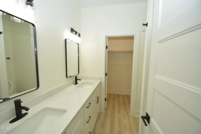 a bathroom with a sink and mirror
