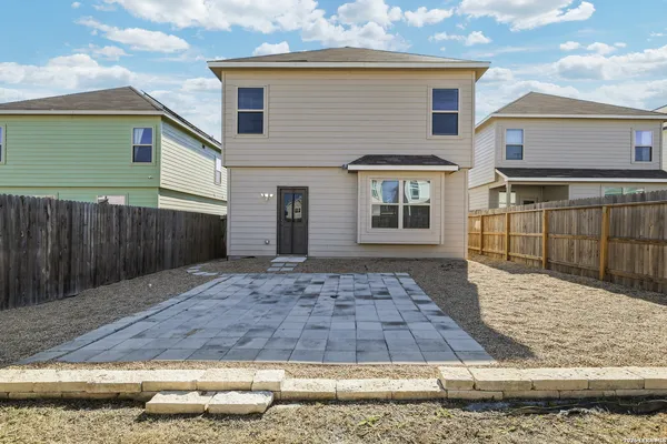 a view of a house with a backyard