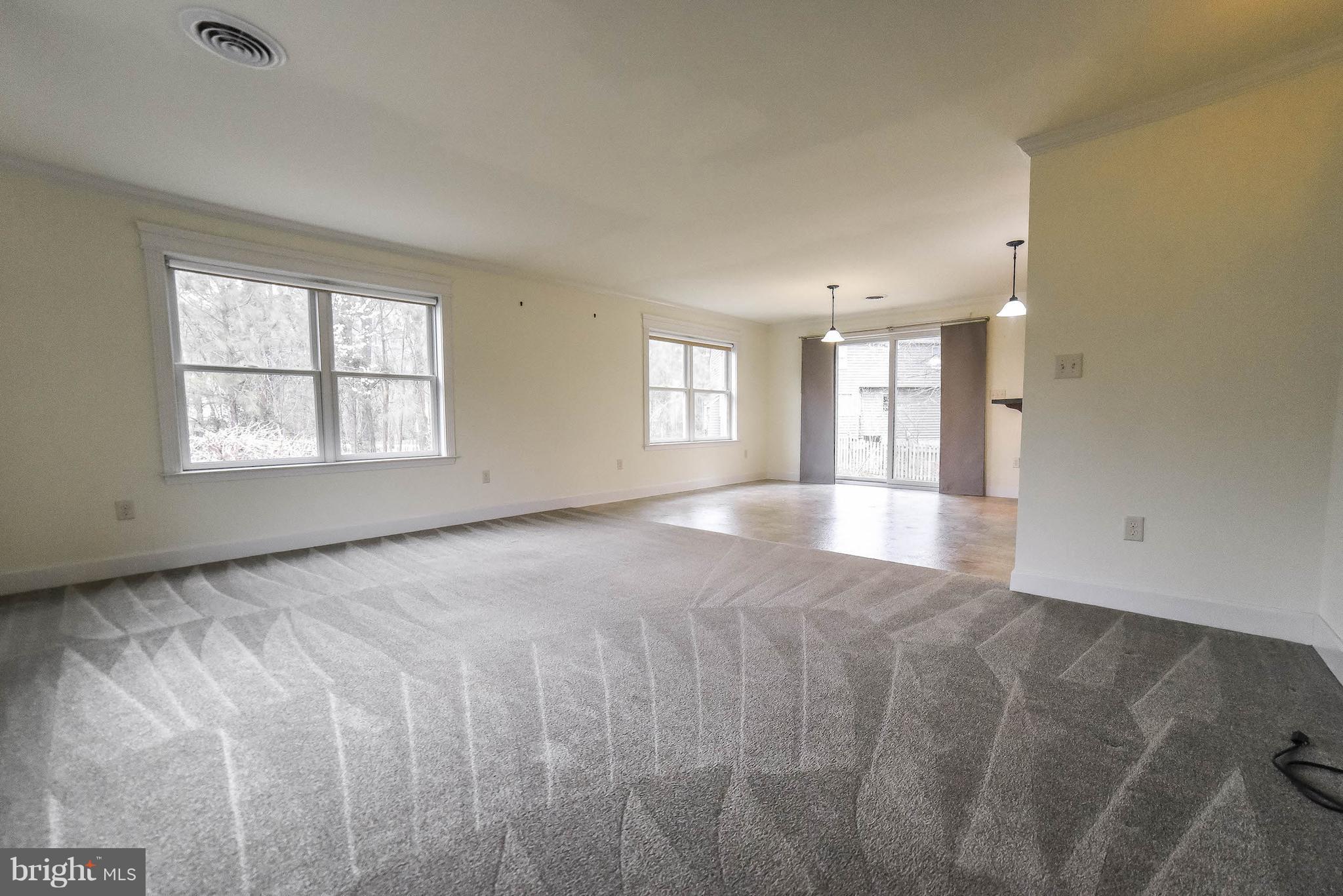 13521 Dowell Road Dowell, MD 20629 - Photo 4 of 30 Open living and dining space with sliders to yard