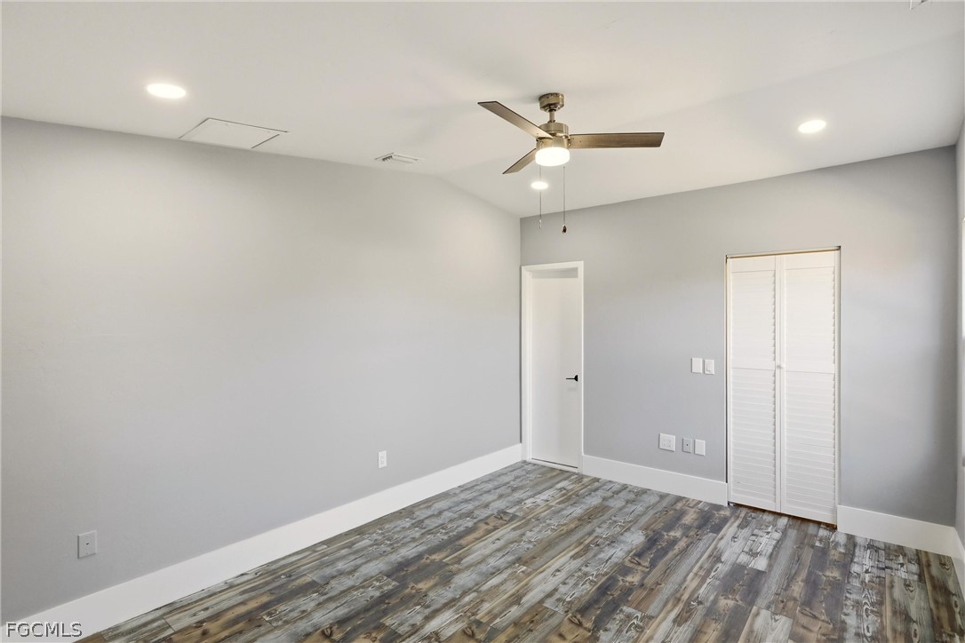 3404 2nd Street Southwest Lehigh Acres, FL 33976 - Photo 17 of 41 an empty room with a window and ceiling fan