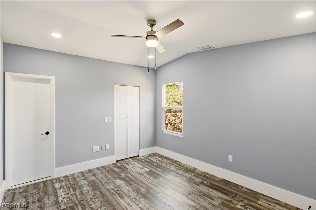 3404 2nd Street Southwest Lehigh Acres, FL 33976 - Photo 18 of 41 a view of an empty room and a window