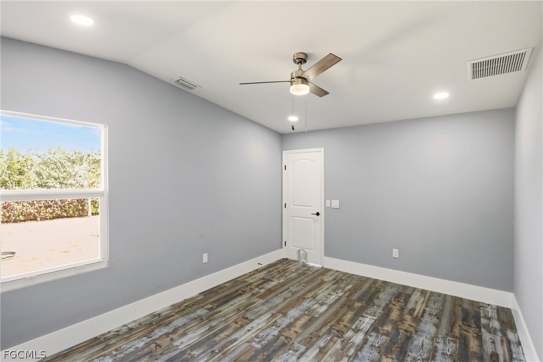 3404 2nd Street Southwest Lehigh Acres, FL 33976 - Photo 19 of 41 a view of an empty room and window