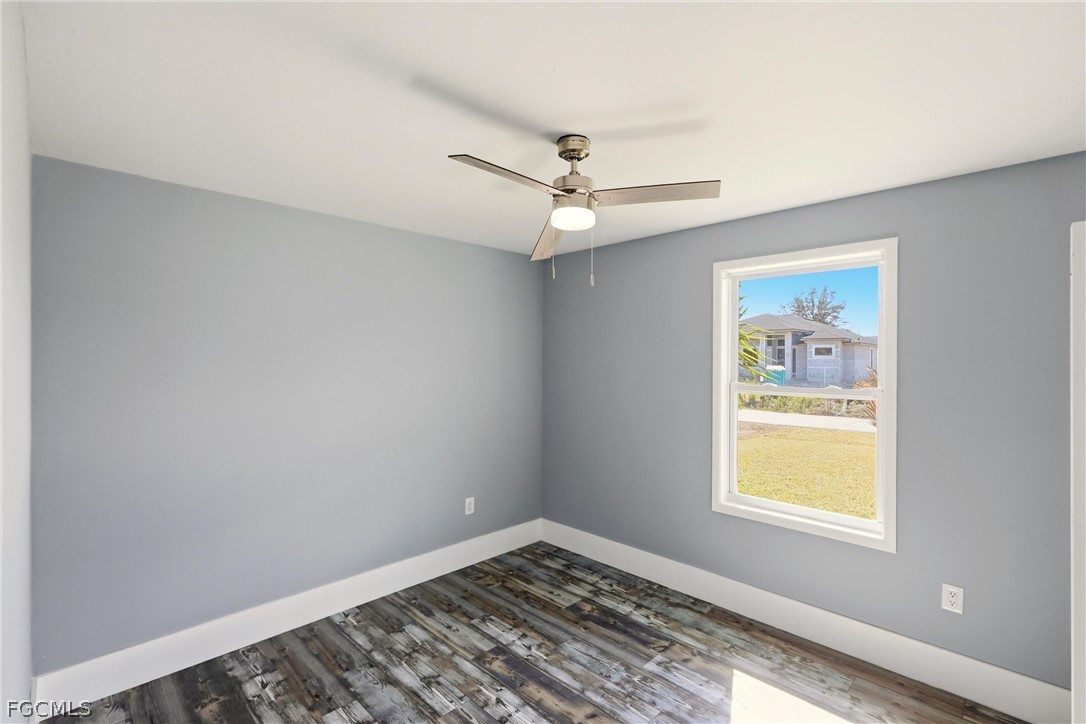 3404 2nd Street Southwest Lehigh Acres, FL 33976 - Photo 28 of 41 a view of an empty room with a window
