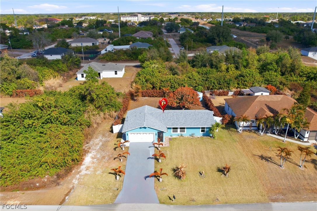 3404 2nd Street Southwest Lehigh Acres, FL 33976 - Photo 35 of 41 an aerial view of residential houses with outdoor space