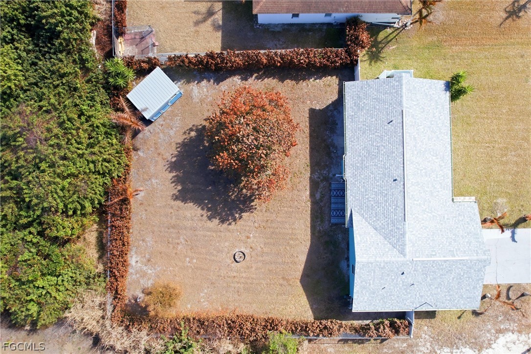 3404 2nd Street Southwest Lehigh Acres, FL 33976 - Photo 40 of 41 an aerial view of residential houses with outdoor space