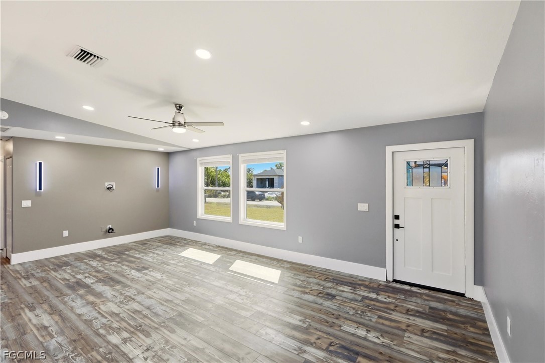 3404 2nd Street Southwest Lehigh Acres, FL 33976 - Photo 9 of 41 a view of an empty room with a window