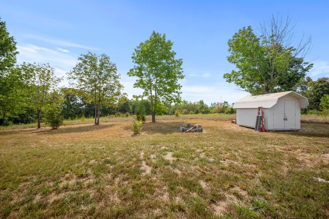 a backyard of a house with lots of green space