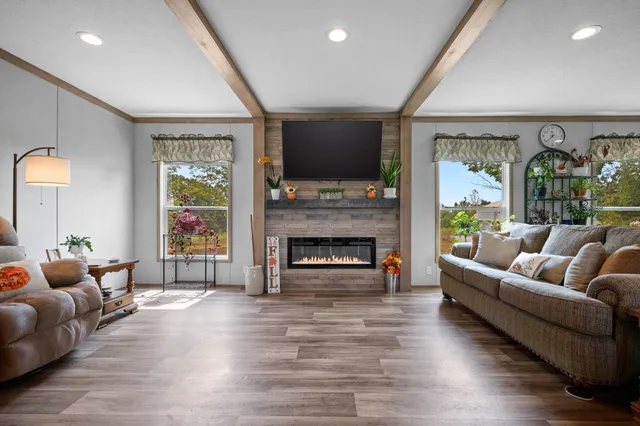 a living room with furniture and a fireplace