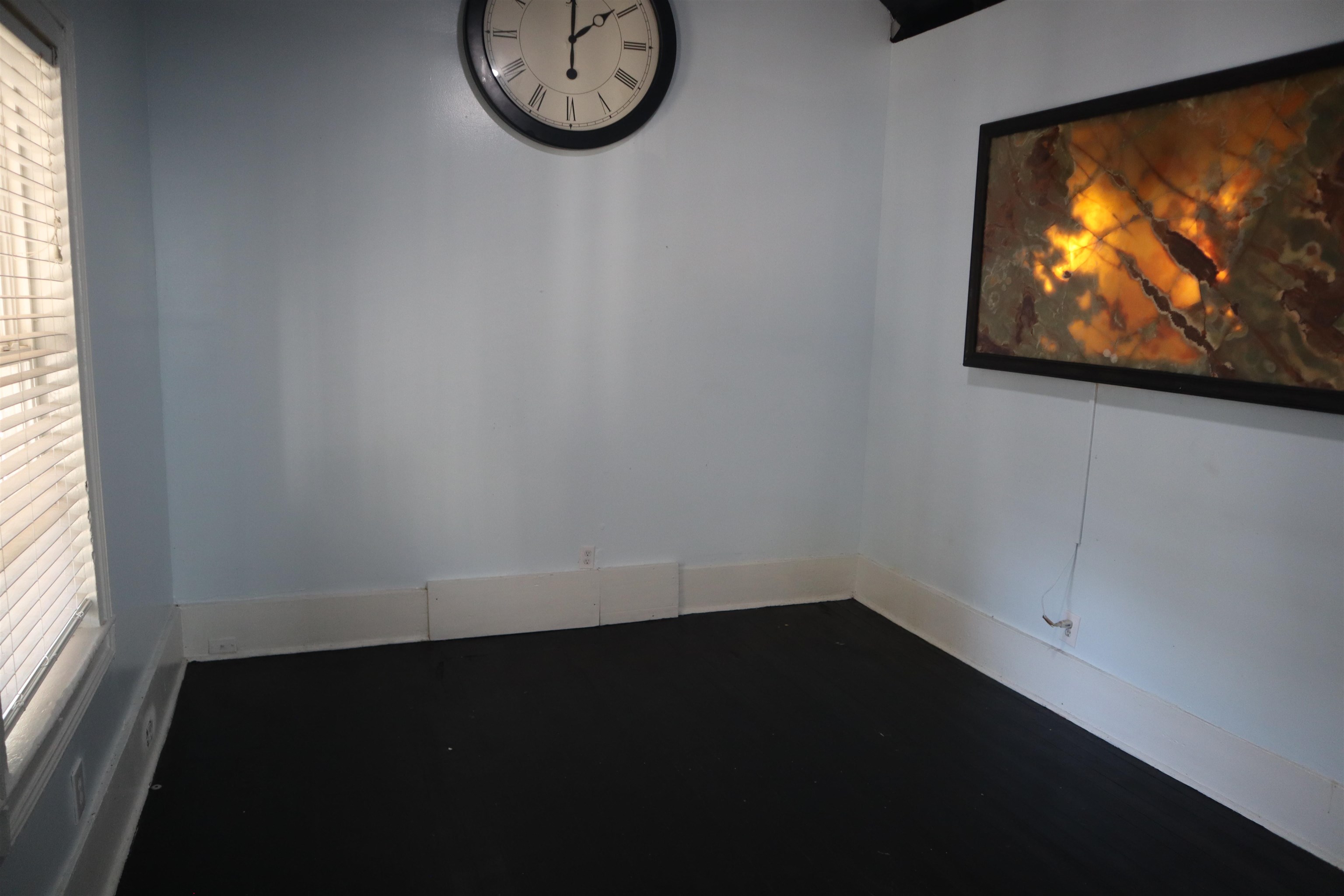 130 Moore Street St. Augustine, FL 32084 - Photo 15 of 27 a view of a livingroom with wooden floor and a window