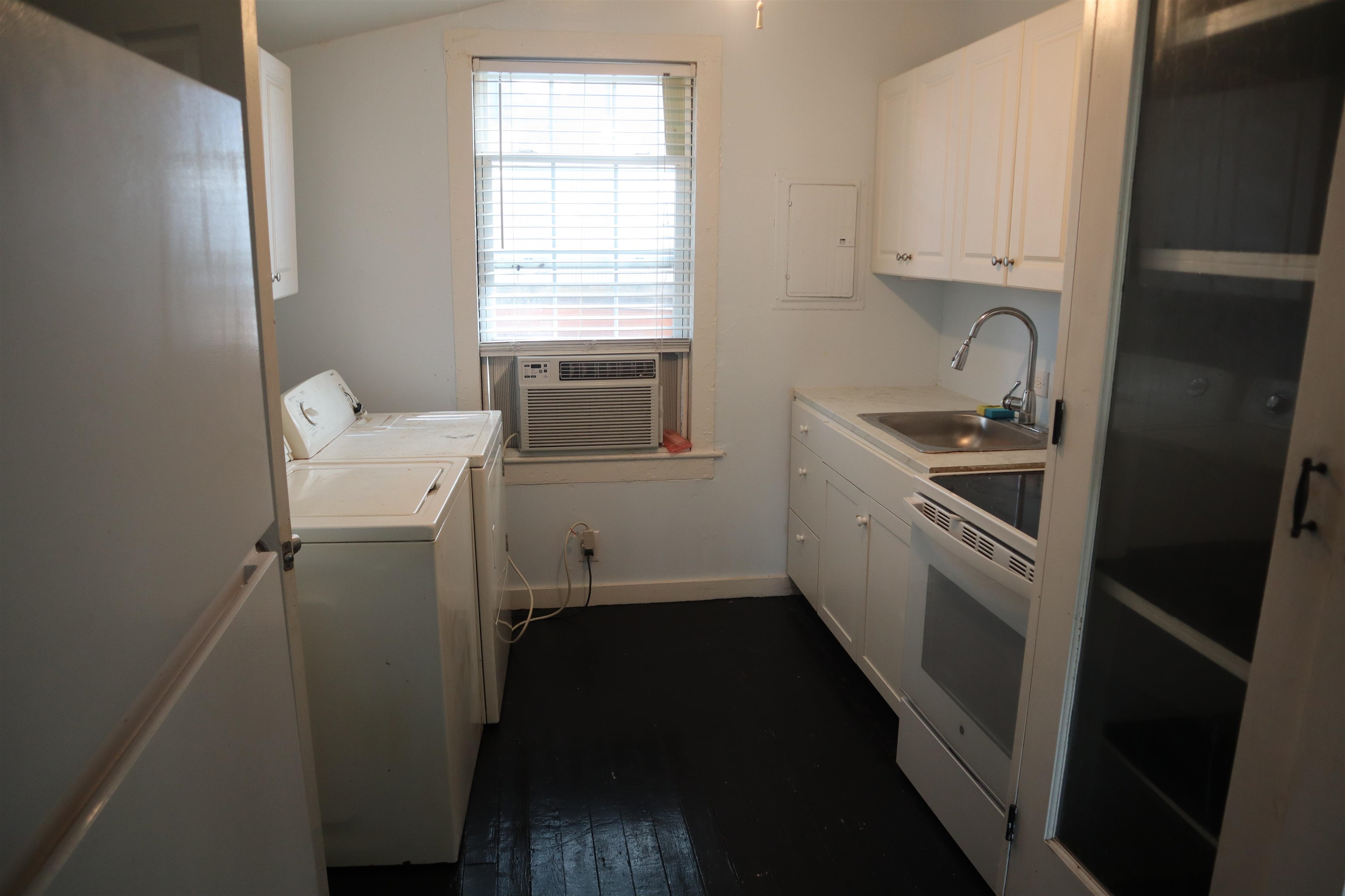 130 Moore Street St. Augustine, FL 32084 - Photo 16 of 27 a kitchen with a sink stove and refrigerator