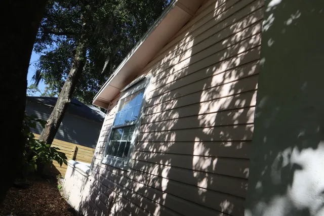 a view of a house with a street