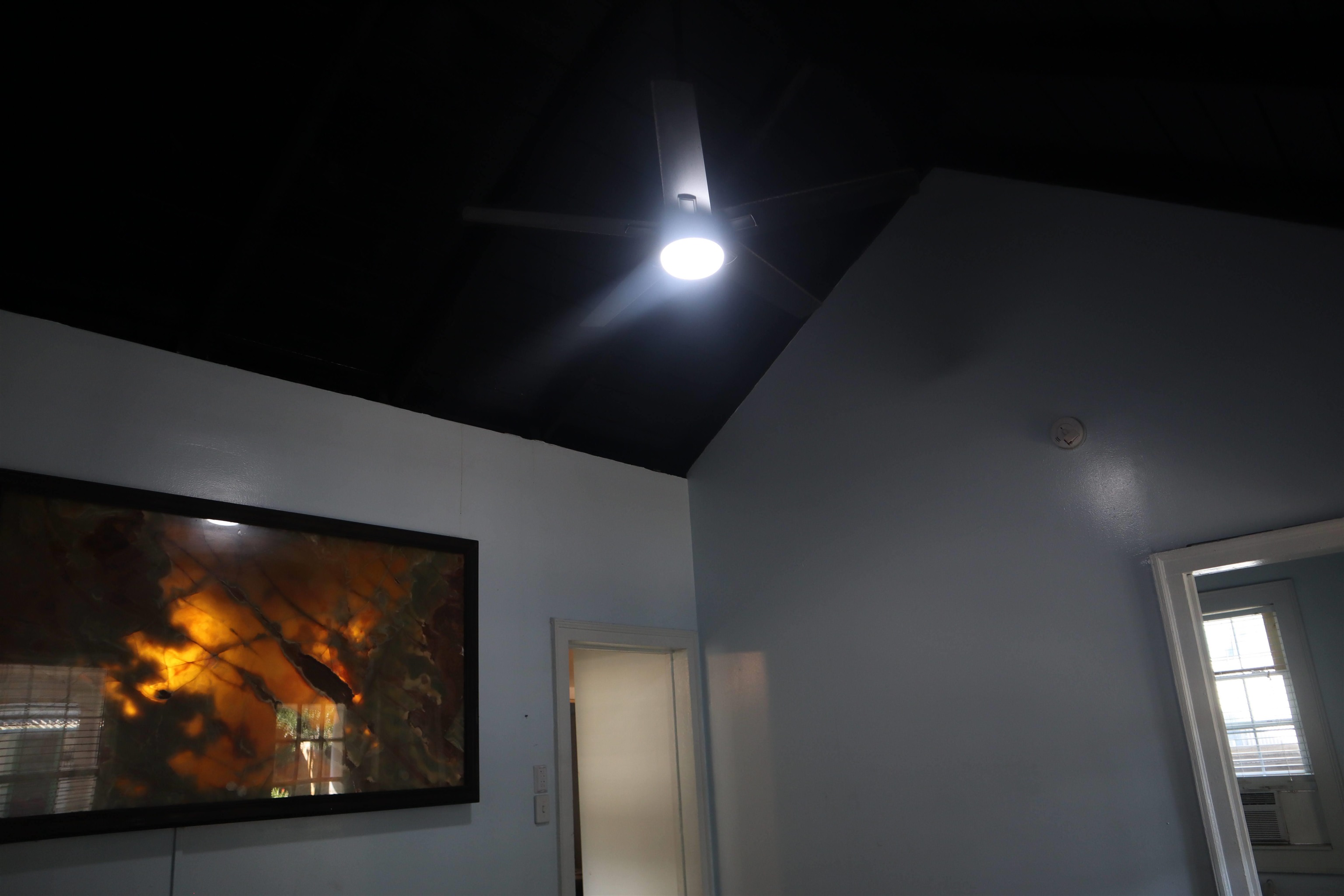 130 Moore Street St. Augustine, FL 32084 - Photo 5 of 27 a view of a living room with a tv screen and fireplace