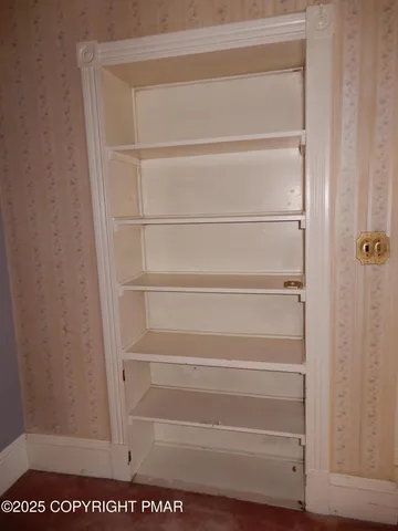 a view of empty room with windows