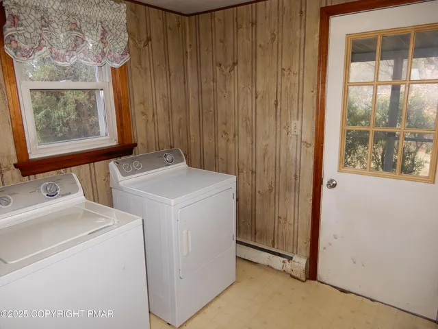 a bathroom with a granite countertop toilet sink and mirror