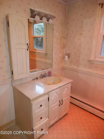 a bathroom with a bathtub and shower
