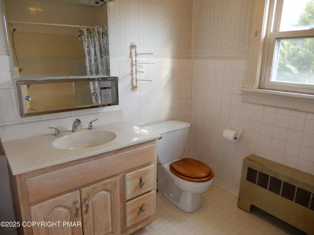 a room with water heater and car