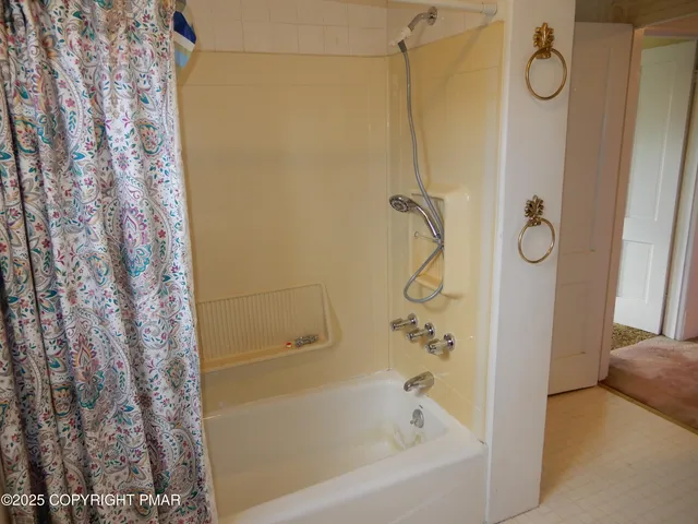 a view of a yard with a tree