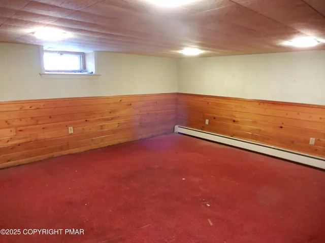 a view of a dry yard with trees