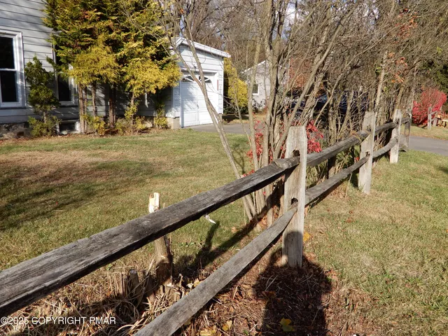 a view of a yard with a tree