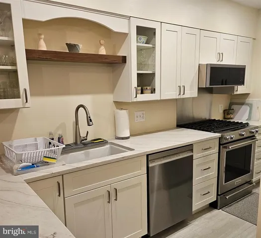a kitchen with a stove and a microwave