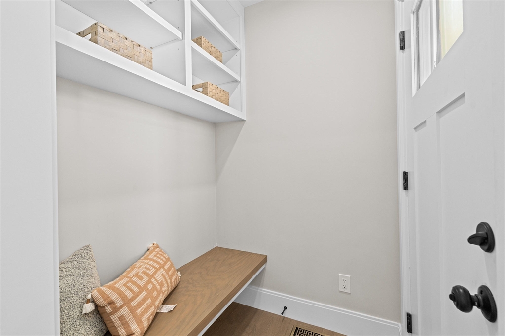 340 Baker Street, Unit 1 Boston, MA 02132 - Photo 12 of 41 a view of a room with rack and stairs