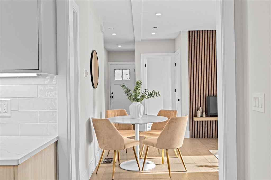 340 Baker Street, Unit 1 Boston, MA 02132 - Photo 13 of 41 a view of a dining room with furniture and wooden floor