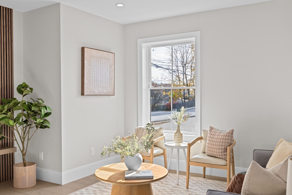 340 Baker Street, Unit 1 Boston, MA 02132 - Photo 19 of 41 a living room with furniture and a potted plant