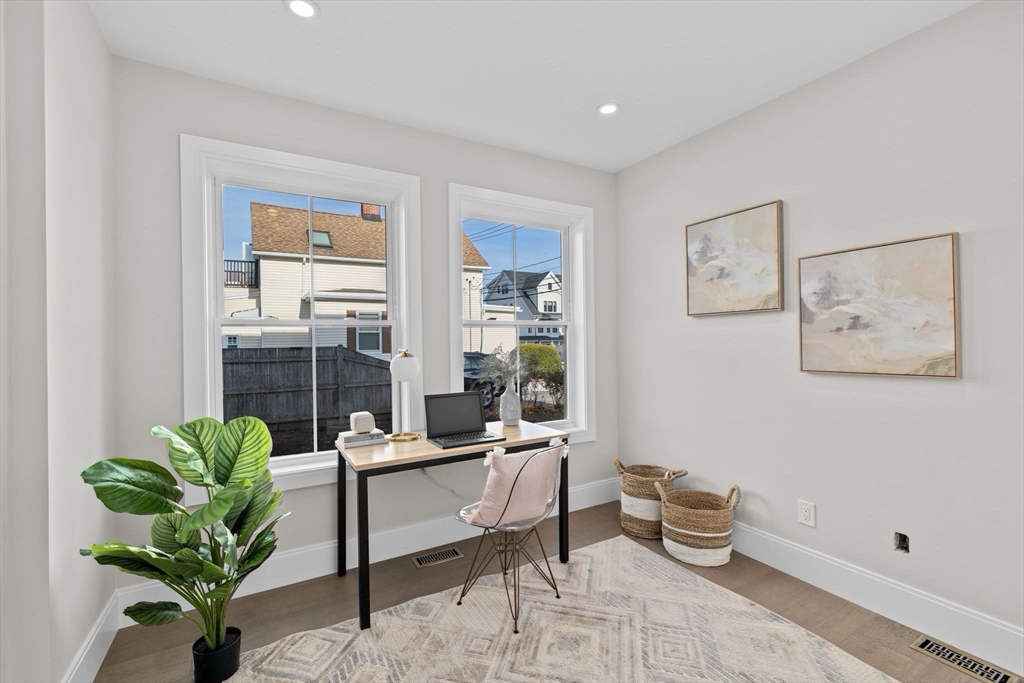 340 Baker Street, Unit 1 Boston, MA 02132 - Photo 23 of 41 a living room with furniture flowerpot and a potted plant