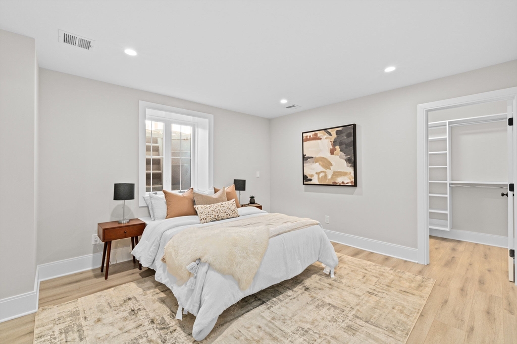 340 Baker Street, Unit 1 Boston, MA 02132 - Photo 24 of 41 a bedroom with a bed and a window