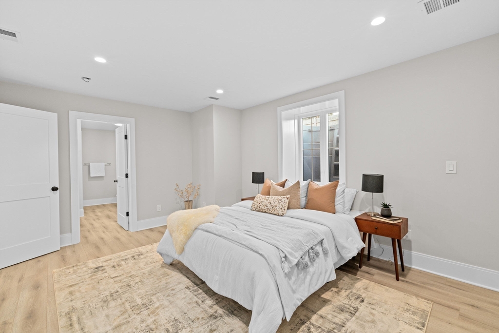 340 Baker Street, Unit 1 Boston, MA 02132 - Photo 25 of 41 a bedroom with a bed and a window