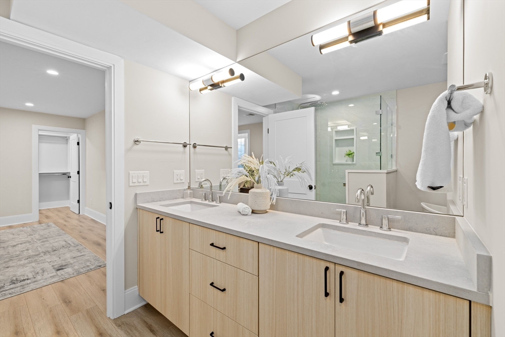 340 Baker Street, Unit 1 Boston, MA 02132 - Photo 26 of 41 a bathroom with a sink double vanity and a mirror