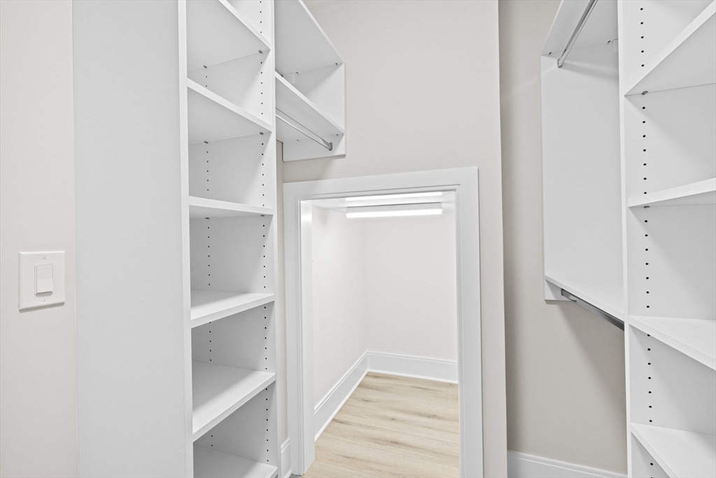 340 Baker Street, Unit 1 Boston, MA 02132 - Photo 33 of 41 a view of staircase with white walls and white walls