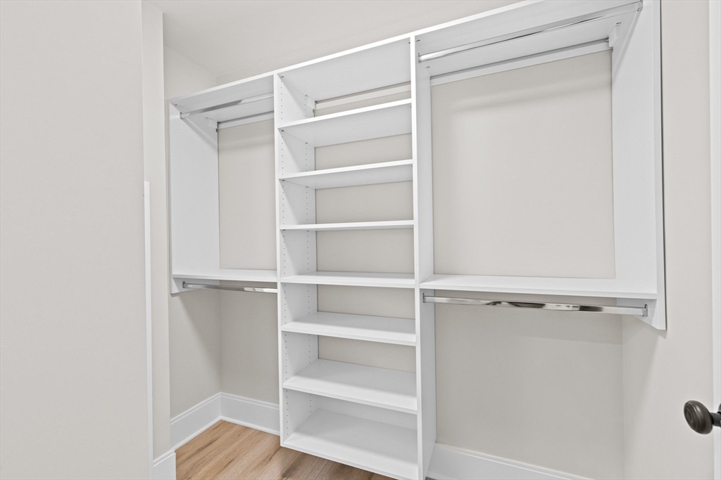 340 Baker Street, Unit 1 Boston, MA 02132 - Photo 34 of 41 a view of walk in closet with empty racks
