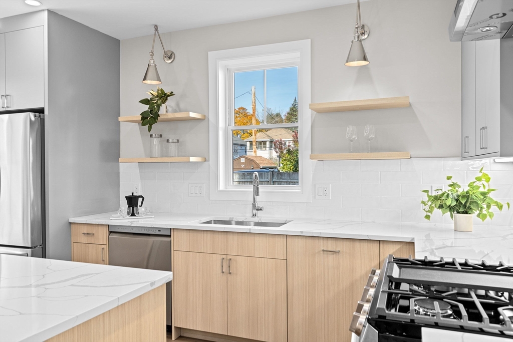 340 Baker Street, Unit 1 Boston, MA 02132 - Photo 7 of 41 a kitchen with a sink and a stove