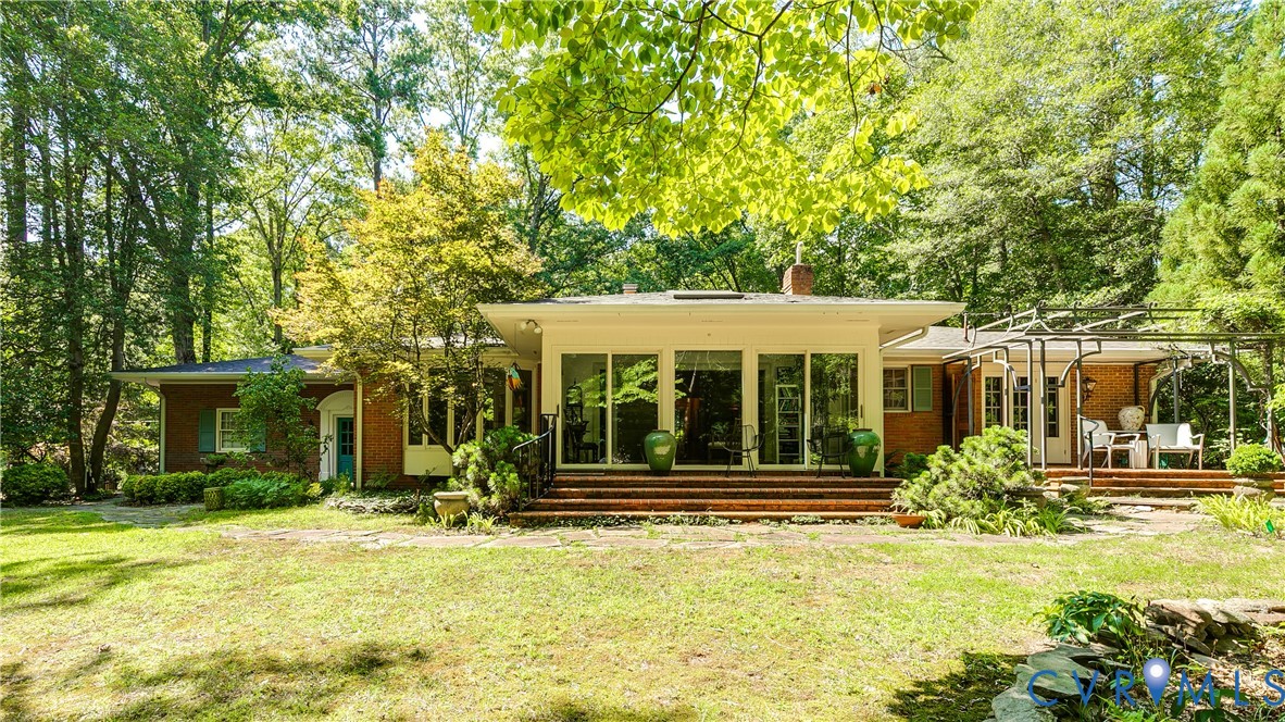 10475 Cherokee Road Richmond, VA 23235 - Photo 48 of 74 Brick exterior with a prominent wall of glass door