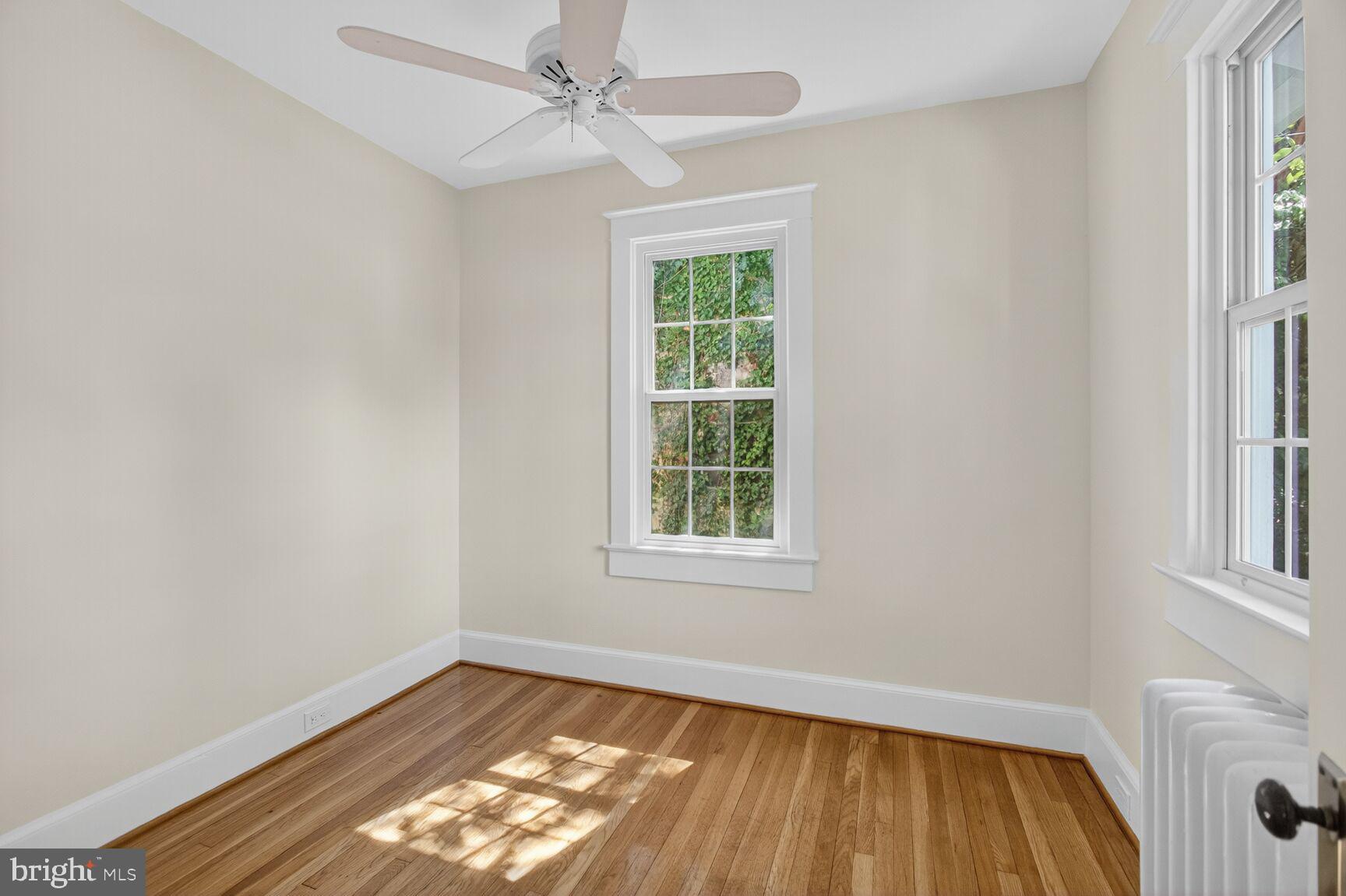 5241 42nd Street Northwest Washington, DC 20015 - Photo 13 of 45 wooden floor in an empty room with a window