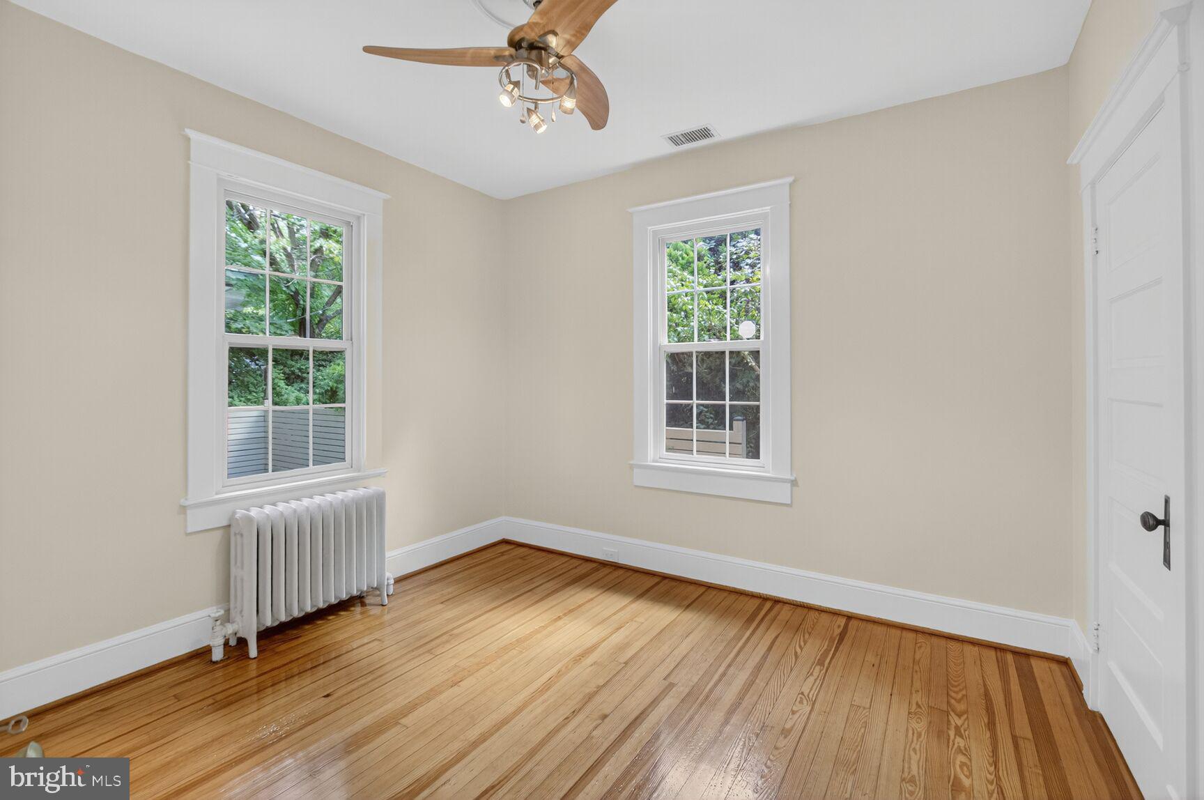5241 42nd Street Northwest Washington, DC 20015 - Photo 16 of 45 a view of an empty room with wooden floor and a window