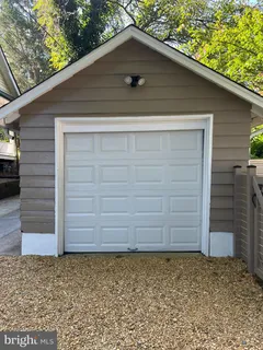 a small white house with a outdoor space