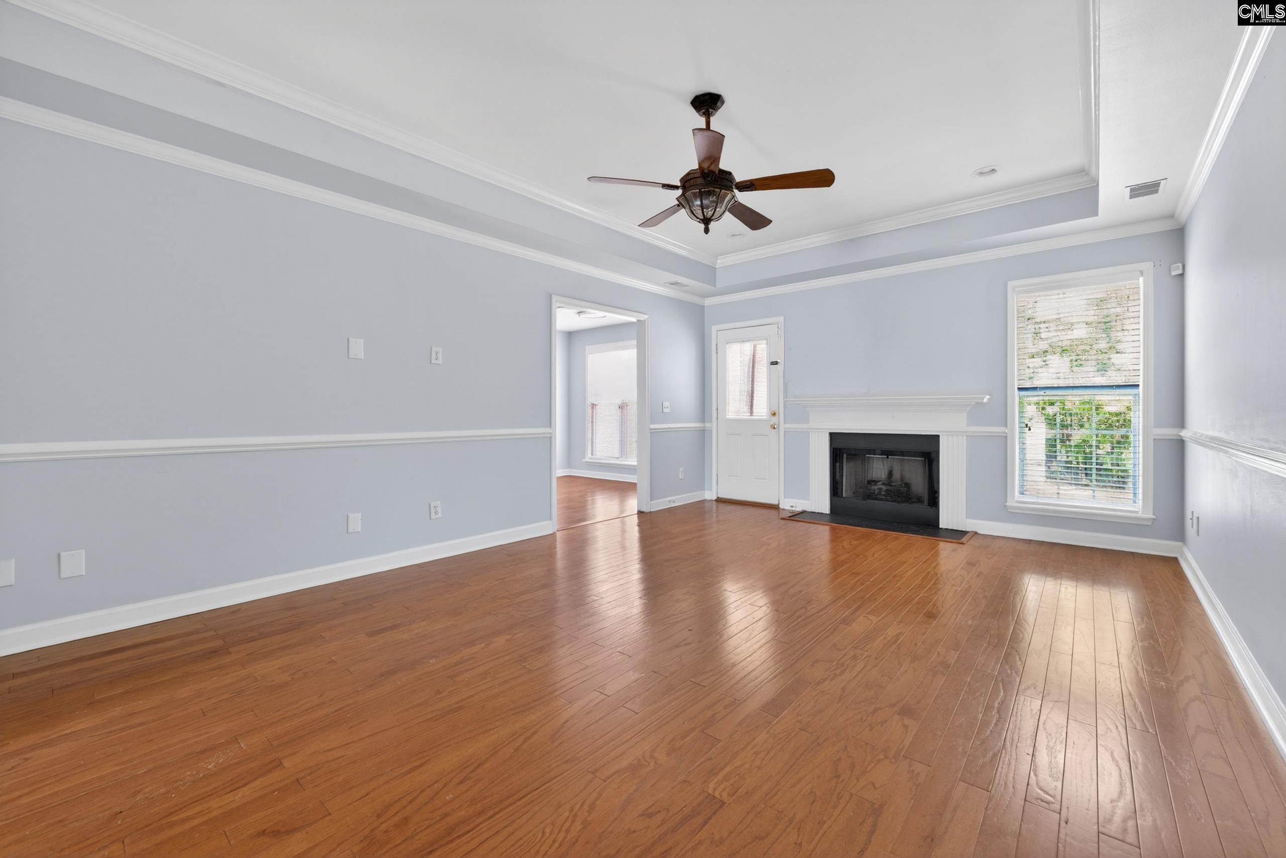 219 Plantation Pointe Drive Elgin, SC 29045 - Photo 31 of 56 a view of empty room with wooden floor and fireplace