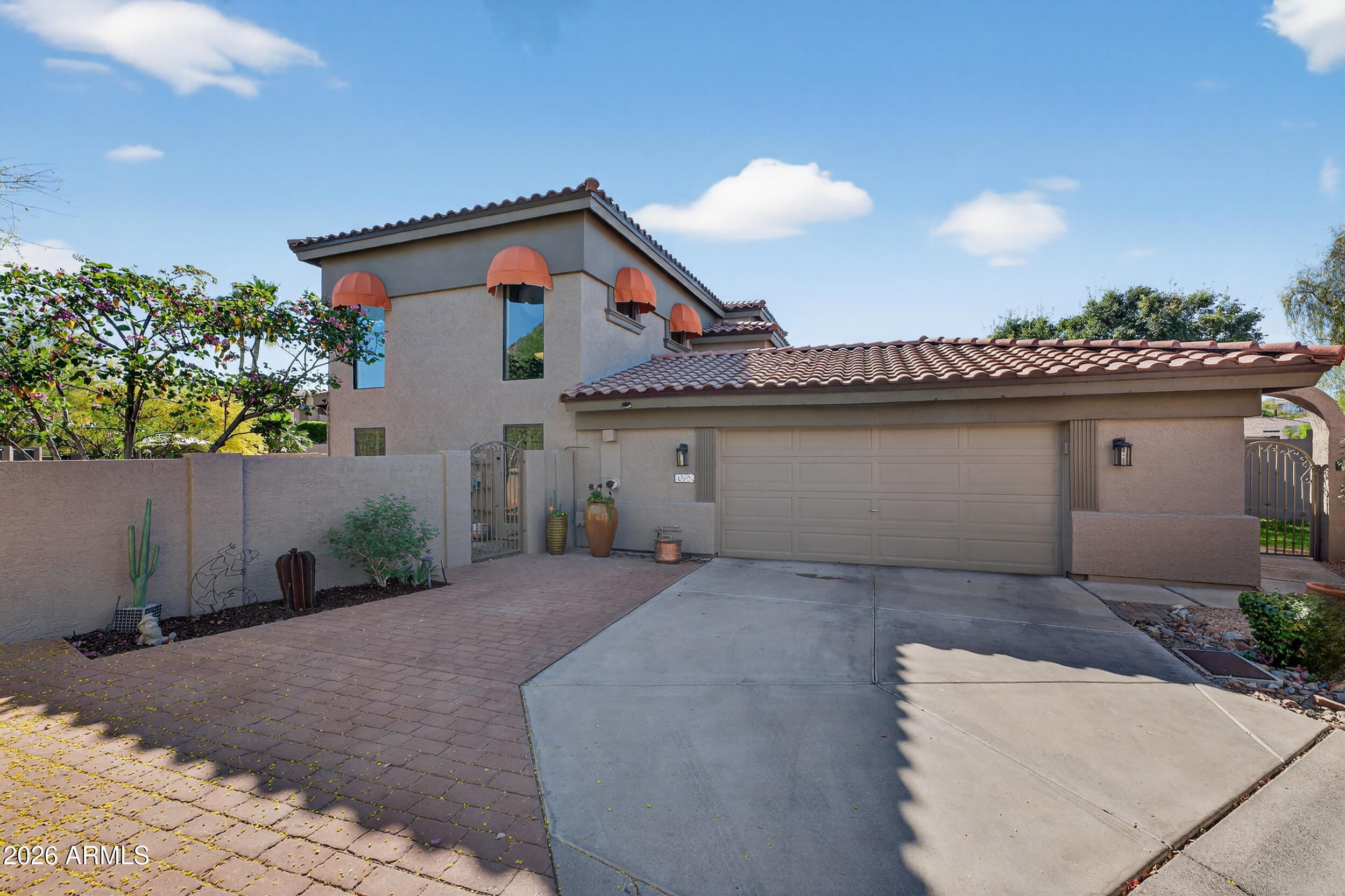1539 East Winged Foot Road Phoenix, AZ 85022 - Photo 11 of 64 a front view of a house with a garage