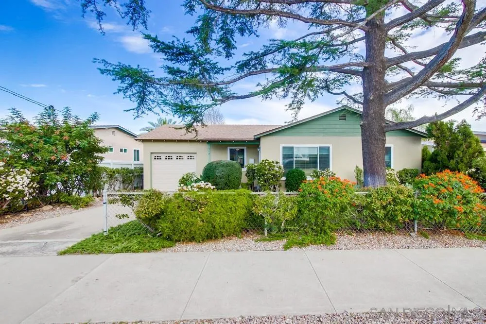 519 El Monte Road El Cajon, CA 92020 - Photo 1 of 3 a front view of a house with a garden