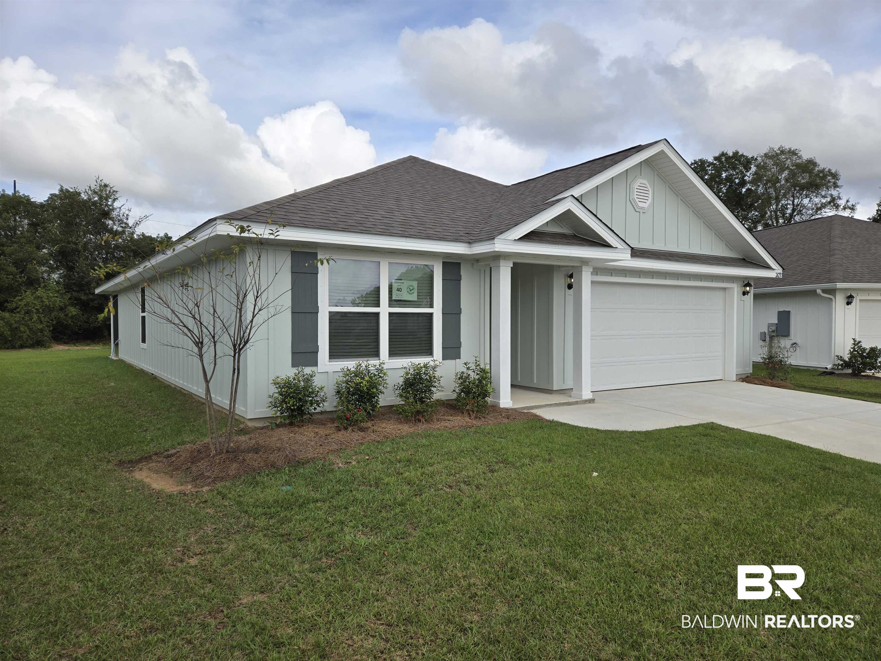 24194 Veranda Circle Elberta, AL 36530 - Photo 2 of 31 View of front of property featuring a front yard and a garage
