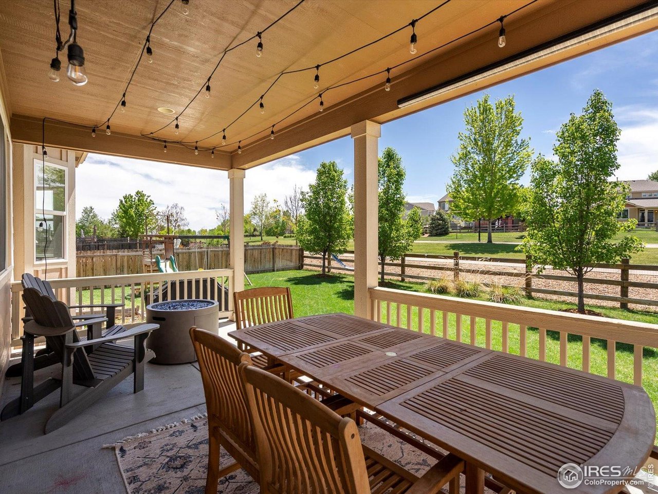 950 Sumner Way Erie, CO 80516 - Photo 28 of 40 Covered back patio with view to neighborhood trail