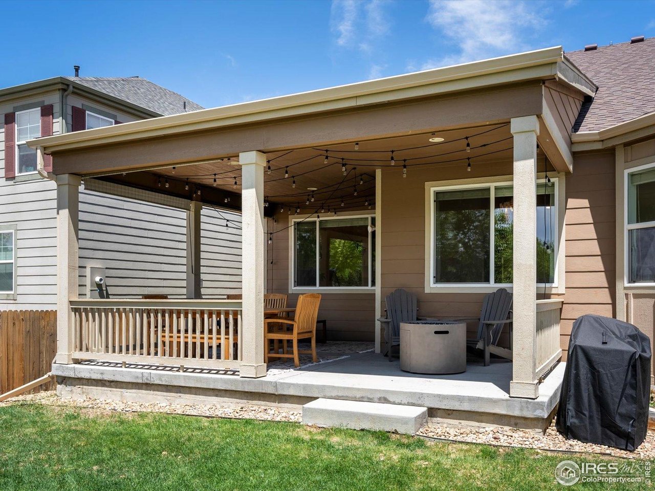 950 Sumner Way Erie, CO 80516 - Photo 29 of 40 Covered back patio with view to neighborhood trail