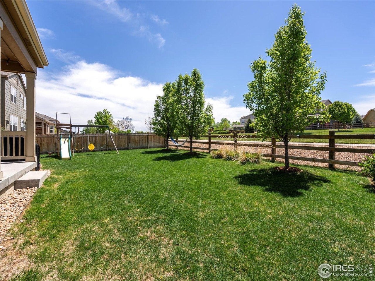 950 Sumner Way Erie, CO 80516 - Photo 30 of 40 Backyard backing to neighborhood trail